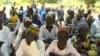 Parents listen as education officials encourage them enroll their children school, in Ashigashia, Cameroon, April 15, 2019.