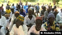 Parents listen as education officials encourage them enroll their children school, in Ashigashia, Cameroon, April 15, 2019.