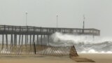 Waves crash into the pier in Ocean City, Maryland October 28, 2012.