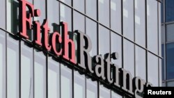 FILE - The Fitch Ratings logo is seen at their offices at Canary Wharf financial district in London, March 3, 2016. 