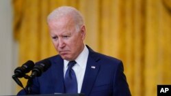 President Joe Biden speaks about the bombings at the Kabul airport that killed at least 12 U.S. service members, from the East Room of the White House, Aug. 26, 2021, in Washington.