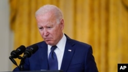 President Joe Biden speaks about the bombings at the Kabul airport that killed at least 12 U.S. service members, from the East Room of the White House, Aug. 26, 2021, in Washington.