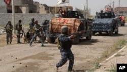 Pasukan keamanan Irak berhasil mengusir militan ISIS dari kota Tikrit di utara Baghdad (30/3).