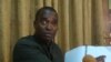 Former information minister Lawrence Bropleh makes a point about auditor general's report at a news conference in Monrovia