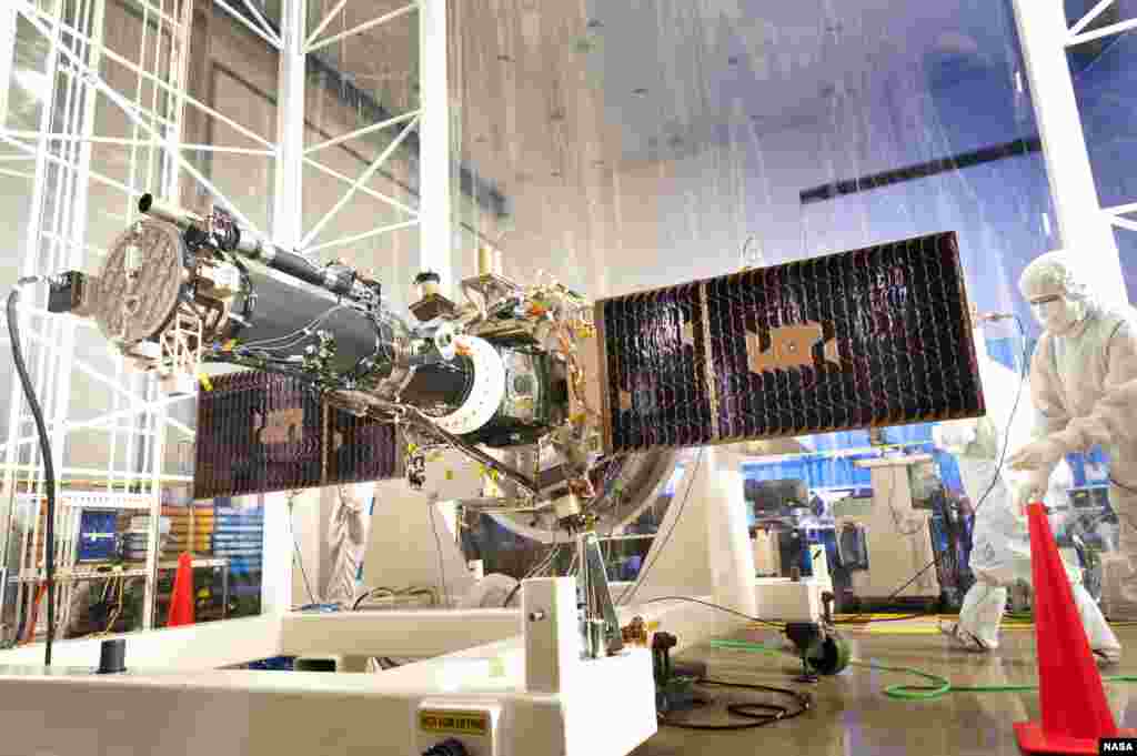 The fully integrated spacecraft and science instrument for NASA&#39;s Interface Region Imaging Spectrograph (IRIS) mission is seen in a clean room at the Lockheed Martin Space Systems Sunnyvale, California facility. (NASA/Lockheed Martin)