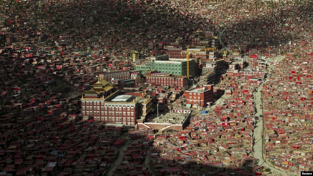 FILE - A view shows the settlements of Larung Gar Buddhist Academy in Serthar County of Ganze Tibetan Autonomous Region, Sichuan province, China, July 23, 2015. 