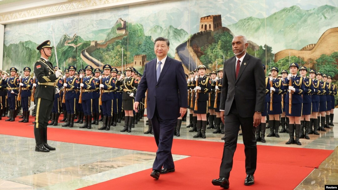 FILE - Chinese President Xi Jinping and Maldivian President Mohamed Muizzu attend a welcome ceremony at the Great Hall of the People in Beijing, Jan. 10, 2024. (cnsphoto via Reuters)
