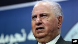 FILE - Ahmad Chalabi speaks to the media in Baghdad.