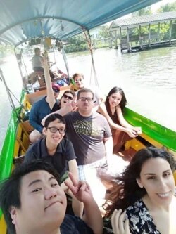 IANG ZHI FAN (LOWER LEFT) CRUISING THROUGH THAILAND'S FLOATING MARKET (Photo credit: IANG ZHI FAN)