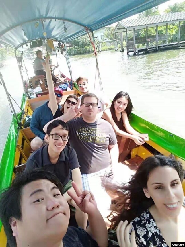 IANG ZHI FAN (LOWER LEFT) CRUISING THROUGH THAILAND'S FLOATING MARKET (Photo credit: IANG ZHI FAN)