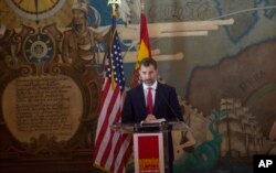 FILE - Spain's Crown Prince Felipe speaks to a crowd as he helps celebrate 500 years of Spanish influence in Florida, Nov. 18, 2013, at Miami's historic Freedom Tower. The prince and princess presented the Juan Ponce de Leon 500th Anniversary award to the Miami Dade College president.