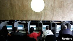 Computer users are seen at an internet cafe in Sao Paulo, Brazil, in this March 3, 2011 file photo. (REUTERS/Nacho Doce)