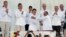 Colombia’s President Juan Manuel Santos, front left, and the top commander of the Revolutionary Armed Forces of Colombia (FARC) Rodrigo Londono, known by the alias Timochenko, shake hands after signing the peace agreement between Colombia’s government and
