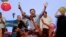 Opposition presidential candidate Mauricio Macri celebrates his victory with supporters at his campaign headquarters in Buenos Aires, Argentina, Nov. 22, 2015