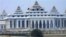 In this photo taken March 27, 2010, daily waged labors work at new parliament building in Nay Pyi Taw, Myanmar. Freedom of speech for members of parliament in military-controlled Myanmar will be restricted under laws that dictate the functioning of the ne