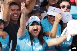 Supporters of El Salvador's newly sworn-in President Nayib Bukele cheer during an inaugural ceremony in Plaza Barrios in San Salvador, El Salvador, June 1, 2019.