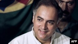 FILE - In this photograph taken on May 20, 1991 National Congress leader Rajiv Gandhi casts his ballot at a polling station in New Delhi for the first round of the general election. 