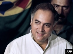 FILE - In this photograph taken on May 20, 1991 National Congress leader Rajiv Gandhi casts his ballot at a polling station in New Delhi for the first round of the general election.