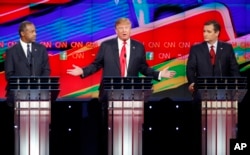 Donald Trump, center, speaks as Ben Carson, left, and Ted Cruz look on during the CNN Republican presidential debate at the Venetian Hotel & Casino on Dec. 15, 2015, in Las Vegas.