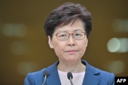 Chief Executive Carrie Lam holds a press conference at the government headquarters in Hong Kong on July 9, 2019. (Photo by Anthony WALLACE / AFP