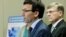 Washington Attorney General Bob Ferguson, center, talks to reporters Sept. 28, 2017, in Seattle, as Seattle City Attorney Pete Holmes, right, looks on.