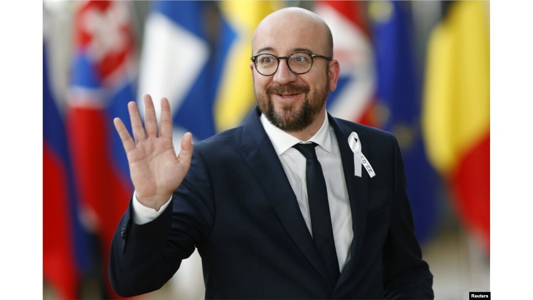 Belgium’s Prime Minister Charles Michel waves as he arrives at a European Union leaders summit in Brussels, Belgium, March 22, 2018.