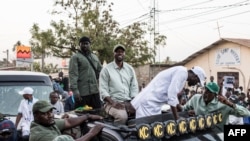 Opposition leader Ousmane Sonko (C) and Presidential candidate for the Diomaye President coalition Bassirou Diomaye Faye (R) attend campaign event in Cap Skirring, Senegal on on March 16, 2024.