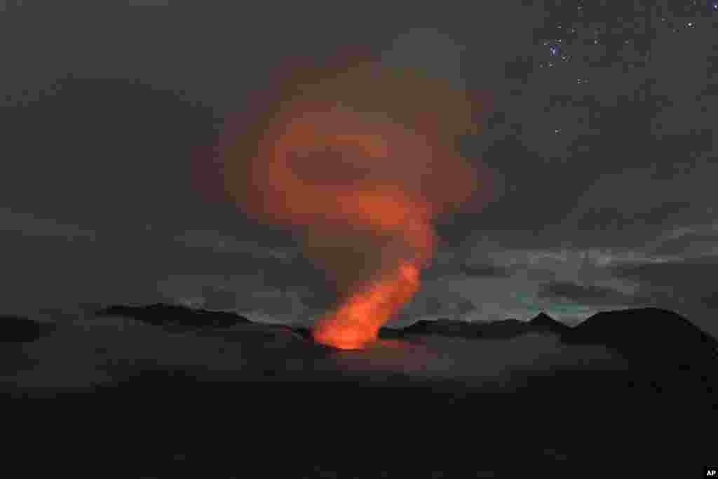 Mount Bromo spews volcanic materials into the air as seen from Ngadisari, East Java, Indonesia.