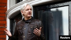 FILE - WikiLeaks founder Julian Assange is seen on the balcony of the Ecuadorian Embassy in London, Britain, May 19, 2017.