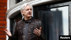 FILE - WikiLeaks founder Julian Assange is seen on the balcony of the Ecuadorian Embassy in London, Britain, May 19, 2017. 