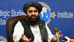 Afghanistan's acting Foreign Minister Amir Khan Muttaqi gestures while speaking during an event held in the Institute of Strategic Studies in Islamabad on Nov.12, 2021.