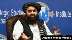 Afghanistan's acting Foreign Minister Amir Khan Muttaqi gestures while speaking during an event held in the Institute of Strategic Studies in Islamabad on Nov.12, 2021. 