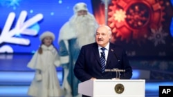 Belarusian President Alexander Lukashenko attends a children's charity event in Minsk on Dec. 28, 2023. Lukashenko also met with children taken from Russia-occupied areas of Ukraine. (Belarusian Presidential Press Service via AP)