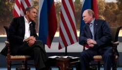 FILE - Then-U.S. President Barack Obama (L) meets with Russian President Vladimir Putin during the G-8 Summit at Lough Erne in Enniskillen, Northern Ireland, June 17, 2013.