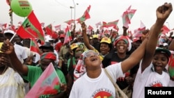 Supporters of Angola's main opposition UNITA party cheer during an election rally in Luanda, August 25, 2012. 