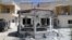 Damaged buildings are seen after gunmen stormed the headquarters of al-Ikbariya news channel near Damascus, Syria, June 27, 2012. 