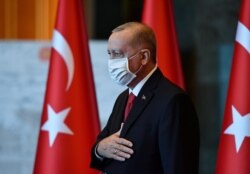 Turkey's President Recep Tayyip Erdogan addresses his ruling party lawmakers at the parliament, in Ankara, Turkey, Oct. 28, 2020.