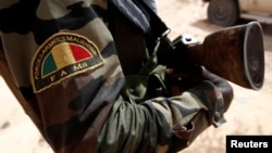 FILE - A Malian Armed Forces patch worn by a soldier is pictured during the regional anti-insurgent Operation Barkhane in Tin Hama, Mali, Oct. 19, 2017. 