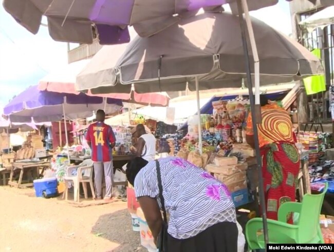 People buy and sell their goods in Ekok, a Cameroonian village on the southwestern border with Nigeria.