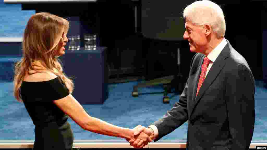 Former President Bill Clinton greets Melania Trump ahead of the start of the first presidential debate between Republican nominee Donald Trump and Democratic nominee Hillary Clinton at Hofstra University in Hempstead, N.Y., Sept. 26, 2016. 
