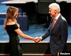 Former President Bill Clinton greets Melania Trump ahead of the start of the first presidential debate between Republican nominee Donald Trump and Democratic nominee Hillary Clinton at Hofstra University in Hempstead, N.Y., Sept. 26, 2016.