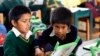 FILE - Students use a laptop at a school in a shantytown on the outskirts of Lima, Peru, June 8, 2012. Peru has sent more than 800,000 laptop computers children across the country, in an effort to leverage digital technology in the fight against poverty.