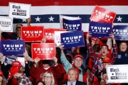 Supporters cheer as President Donald Trump speaks during a campaign rally, Feb. 28, 2020, in North Charleston, S.C.