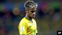 FILE - Brazil's Neymar looks down during the group A World Cup soccer match between Brazil and Mexico at the Arena Castelao in Fortaleza, Brazil, June 17, 2014.