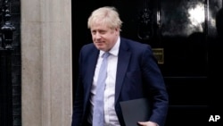 Britain's Prime Minister Boris Johnson leaving 10 Downing Street as he made his way to the House of Commons, in London, Jan. 31, 2022.