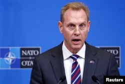 FILE - Acting U.S. Secretary of Defense Pat Shanahan holds a news conference in Brussels, Belgium, Feb. 14, 2019.