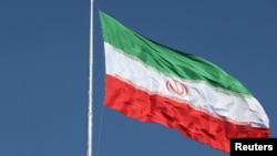 FILE: The Iranian flag is seen flying over a street in Tehran, Iran, February 3, 2023. Majid Asgaripour/WANA (West Asia News Agency) 