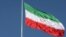 FILE - The Iranian flag is seen flying over a street in Tehran, Iran, February 3, 2023. Majid Asgaripour/WANA (West Asia News Agency) 