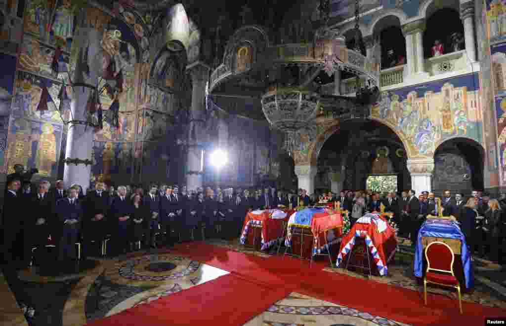 The coffins of Serbian King Petar II Karadjordjevic and his wife Queen Aleksandra, his mother Queen Maria and brother Prince Andrej inside the St. George's Church on Oplenac Hill during their funeral in Topola, some 71km (44 miles) south of Belgrade, Serbia. Hundreds of mourners gathered for the reburial of Serbian royals, decades after their deaths in exile.