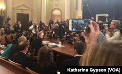 Democratic presidential candidate, former Secretary of State Hillary Clinton takes her seat before testifying before the House Benghazi Committee on Capitol Hill, in Washington, D.C., Oct. 22, 2015